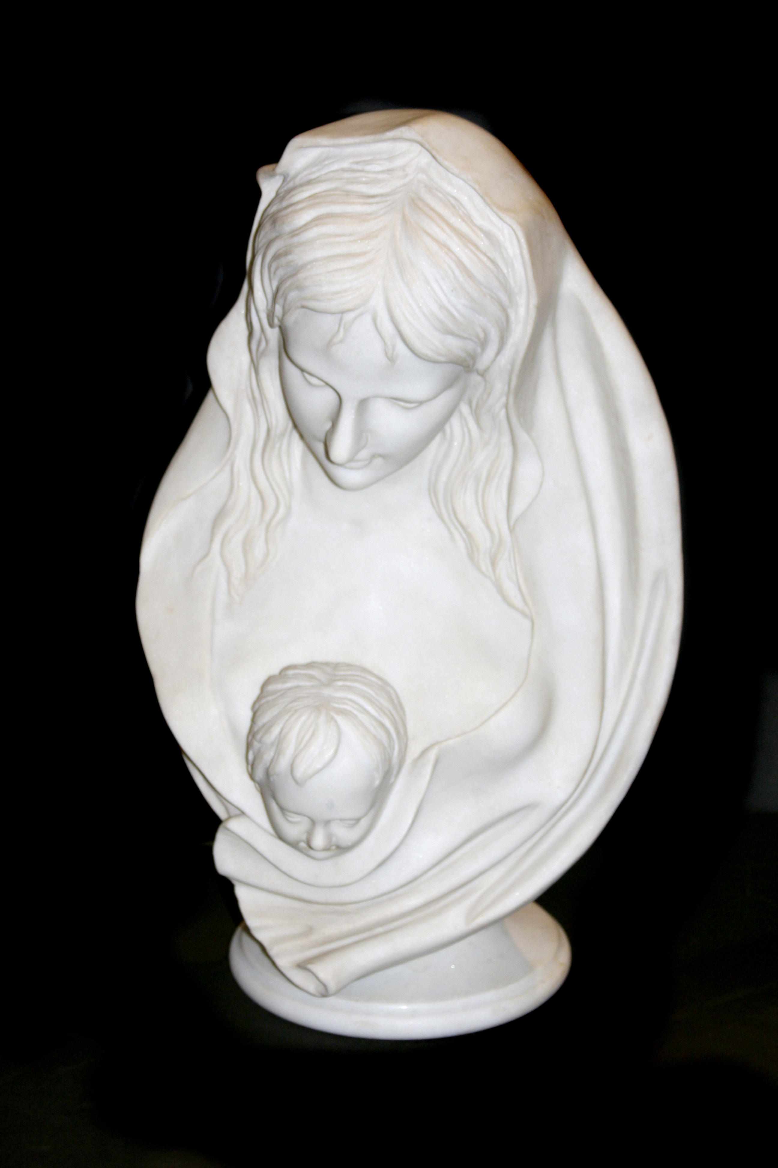 Appraisal: A carved marble bust of a woman and child height