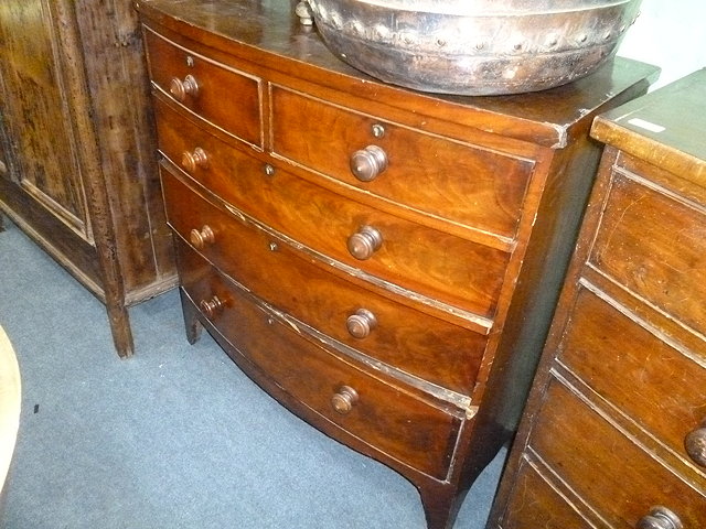 Appraisal: A VICTORIAN MAHOGANY BOW FRONT CHEST of two short and