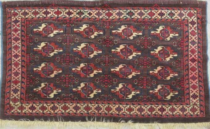 Appraisal: TURKOMAN BOKHARA CHUVAL repeating geometric gol design on horizontal brown