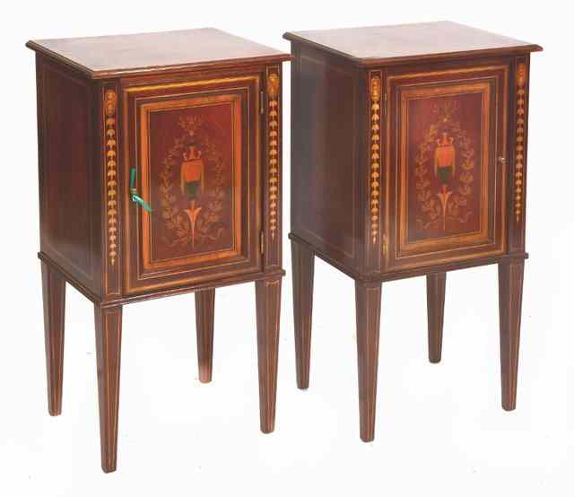 Appraisal: A PAIR OF EDWARDIAN MAHOGANY BEDSIDE CABINETS the tops with