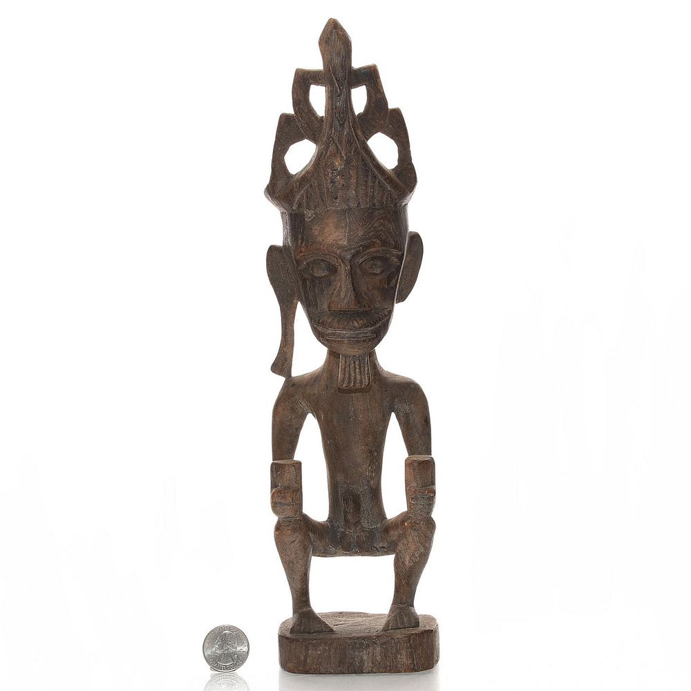 Appraisal: TRIBAL AFRICAN WOODEN SCULPTURE OF NUDE MAN Hand carved with