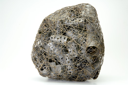 Appraisal: CLAIRE FALKENSTEIN Sculpture of tin cans inside a net of