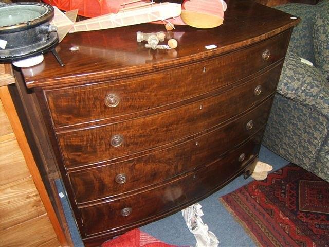 Appraisal: A Victorian mahogany bow front chest of four long drawers