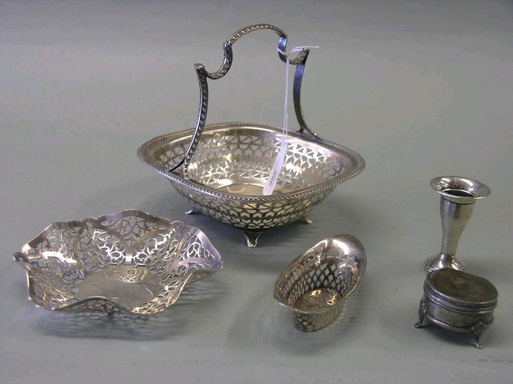 Appraisal: A silver biscuit basket with gadrooned handle and pierced detail