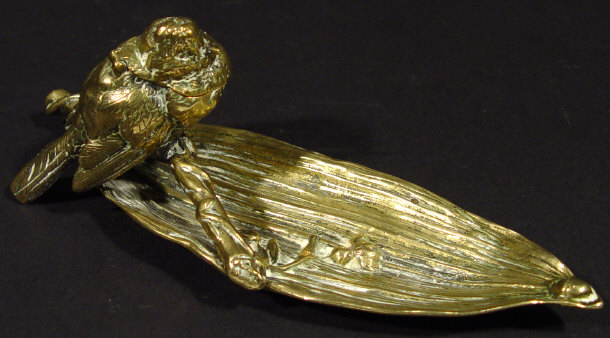 Appraisal: Aesthetic style brass pen tray mounted with a bird design