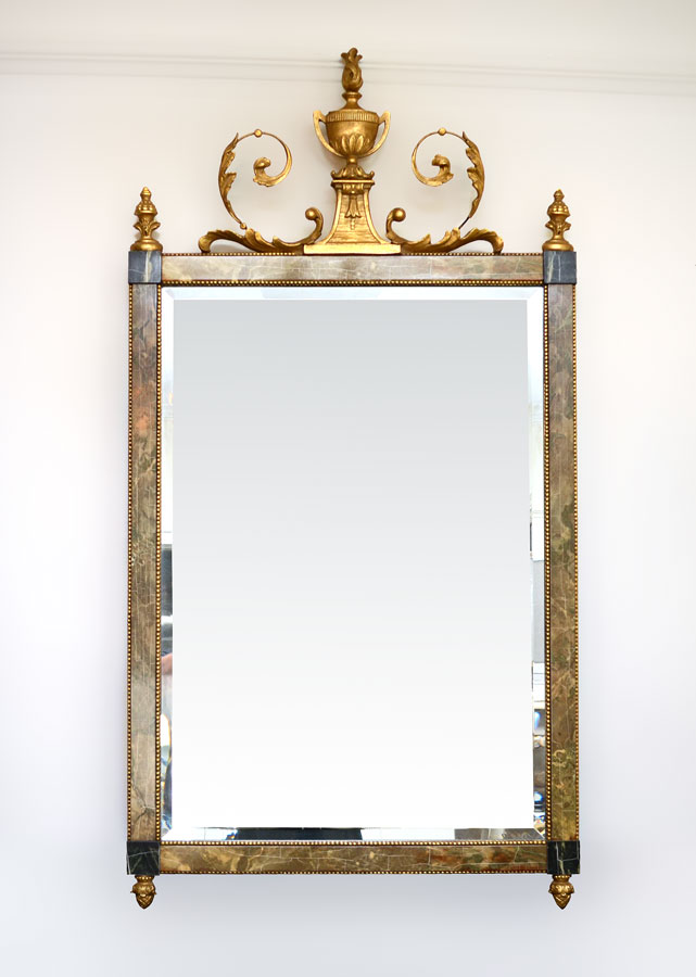 Appraisal: GILDED FAUX MARBLE WALL MIRROR Carved and gilt wood urn