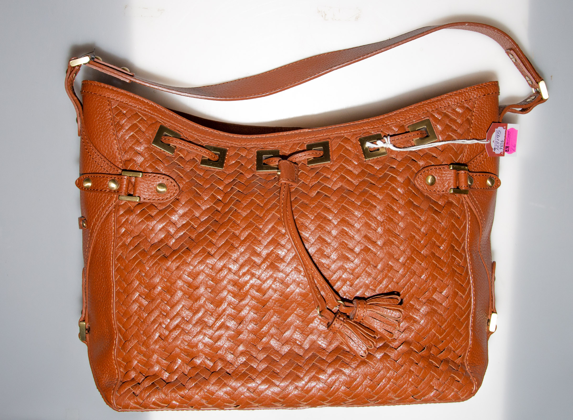 Appraisal: COLE HAAN BROWN WOVEN LEATHER HANDBAG almost new condition in