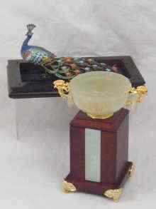 Appraisal: A jadeite bowl on tall hardwood plinth in presentation case