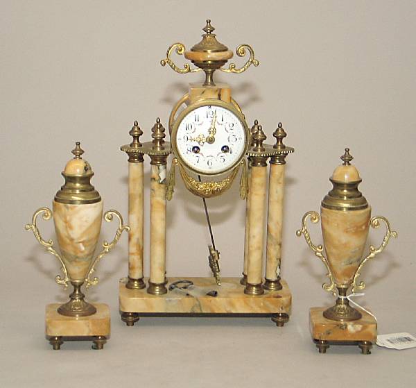 Appraisal: A French gilt bronze mounted Siena marble three-piece portico clock