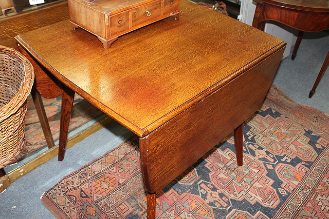 Appraisal: A MID TH CENTURY OAK DROP LEAF DINING TABLE with