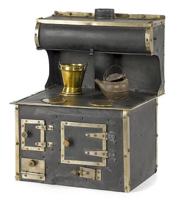 Appraisal: Tin and nickel toy cook stove '' h Tin and