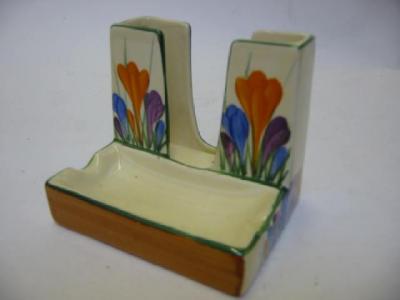 Appraisal: A CLARICE CLIFF BIZARRE HONEYGLAZE CIGARETTE HOLDER and integral ashtray