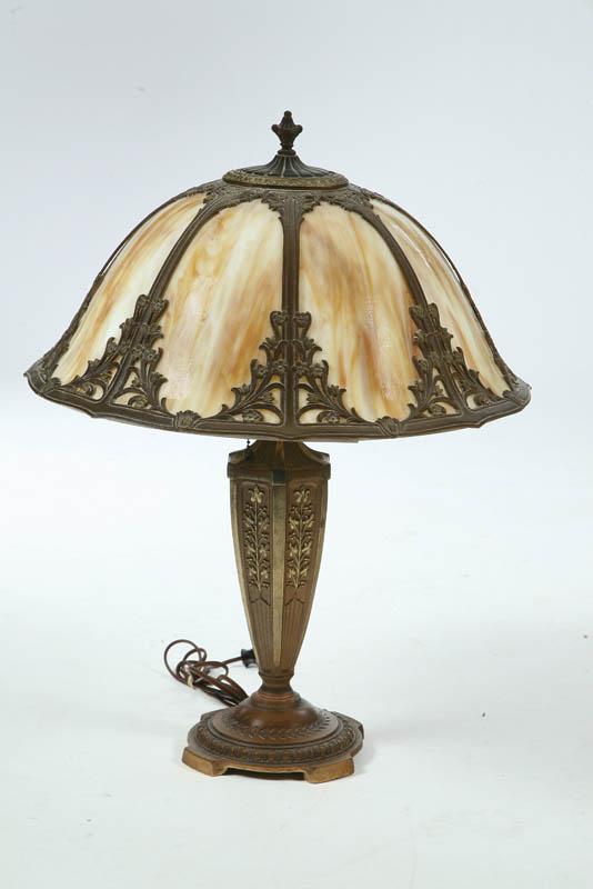 Appraisal: TABLE LAMP The lamp has a slag glass paneled helmet-shaped