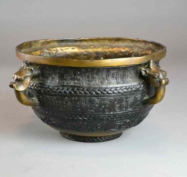 Appraisal: A Fine Chinese Bronze Incense BurnerWith four finely casted dragon