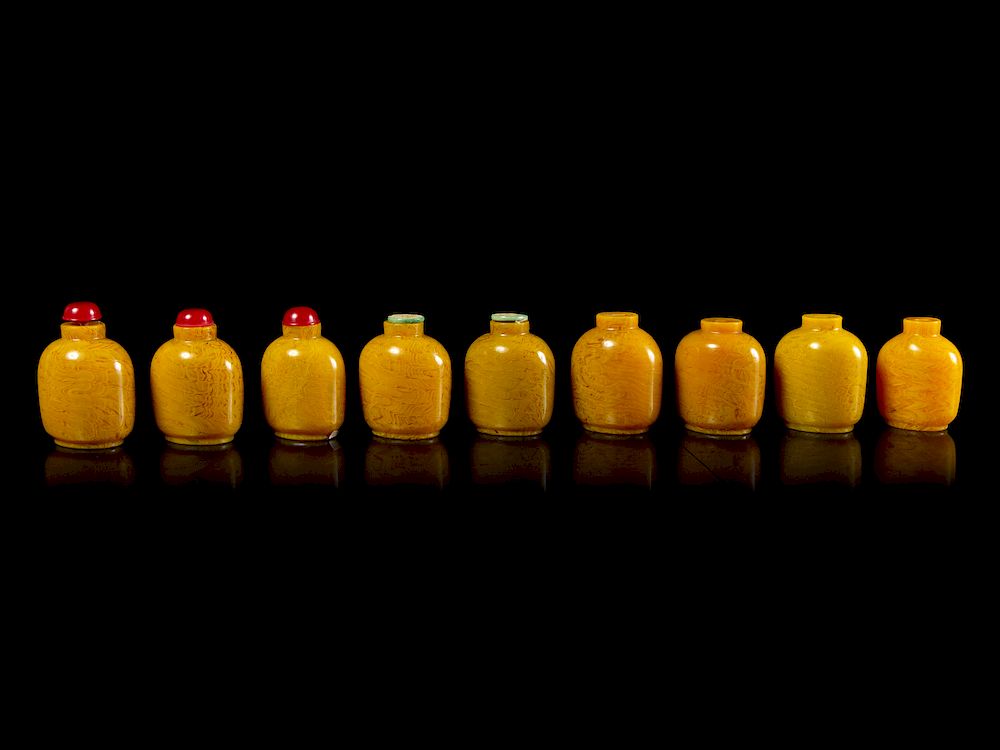 Appraisal: Nine Chinese Yellow Glass Snuff Bottles Each height in cm