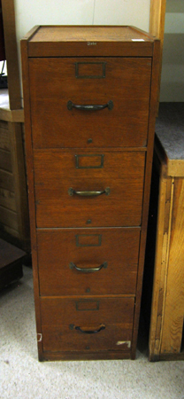 Appraisal: AN OAK FOUR-DRAWER VERTICAL FILE CABINET Globe Co Ohio early