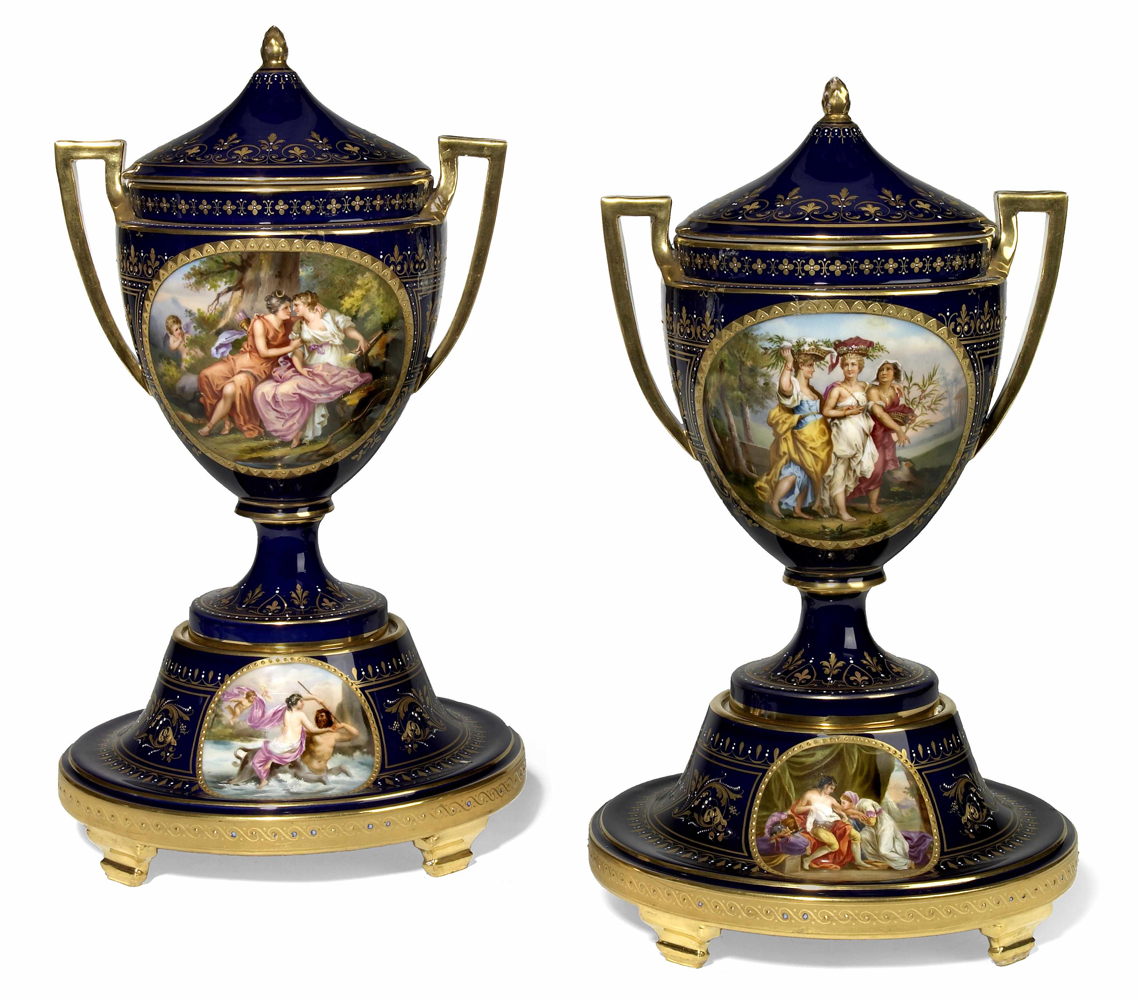 Appraisal: A pair of Vienna style porcelain 'jeweled' two handled urns