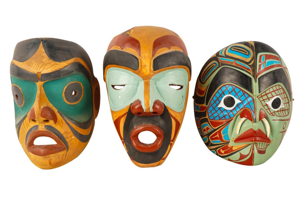 Appraisal: THREE PACIFIC NORTHWEST STYLE CARVED PAINTED MASKSone marked in ink