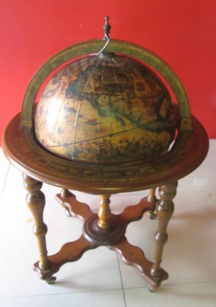 Appraisal: A WORLD GLOBE DRINKS DISPENSER STANDING ON CASTORS A WORLD