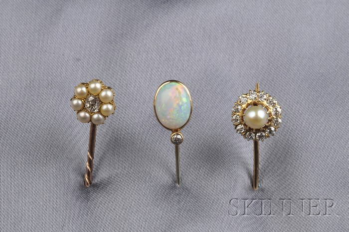 Appraisal: Three Stickpins an oval cabochon opal with a diamond melee