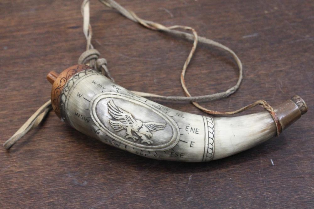 Appraisal: CARVED BLACK POWDER HORN having a relief carved eagle with