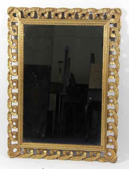 Appraisal: A rectangular gilt plaster wall mirror with lattice surround the