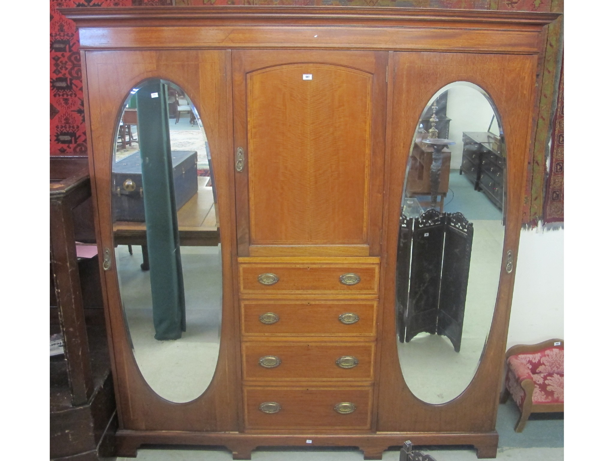 Appraisal: Edwardian mahogany triple door wardrobe