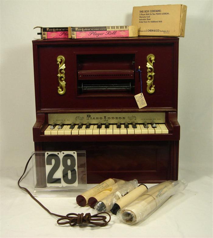 Appraisal: Chein Piano with rolls inches tall inches long and inches