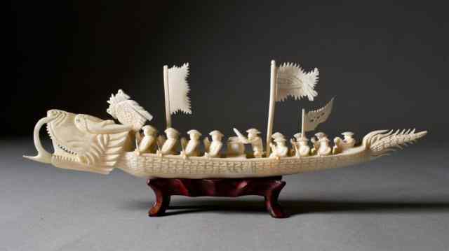 Appraisal: Chinese Carved Ivory Dragon Boat figures on the boat Late