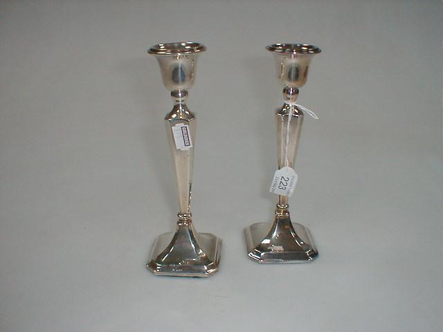 Appraisal: A pair of George V silver candlesticks Chester high