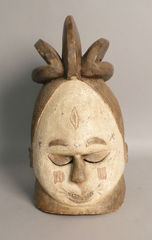 Appraisal: Carved African helmet mask with a white painted face h