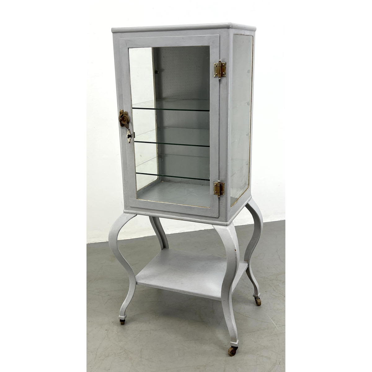 Appraisal: Antique Steel medical cabinet with glass doors Light blue Cabriole