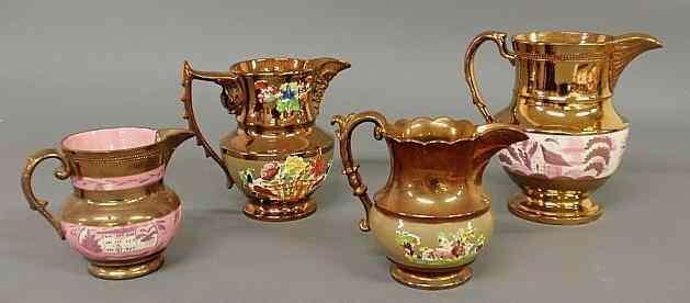 Appraisal: Group of four copper luster pitchers largest h