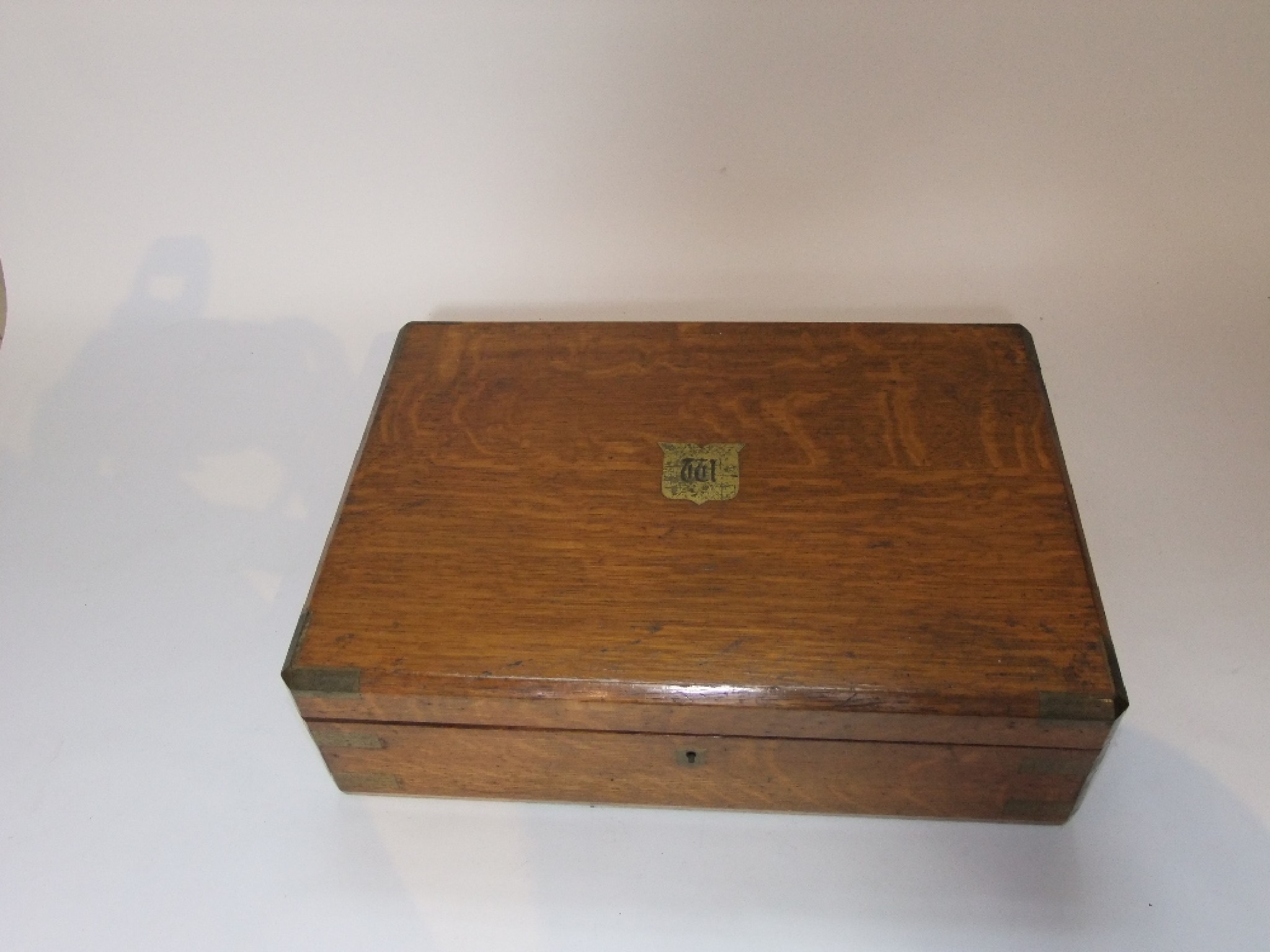 Appraisal: An early th century oak cased cutlery canteen with divisional