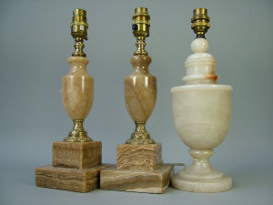 Appraisal: A pair of gilt metal mounted variegated alabaster table lamps