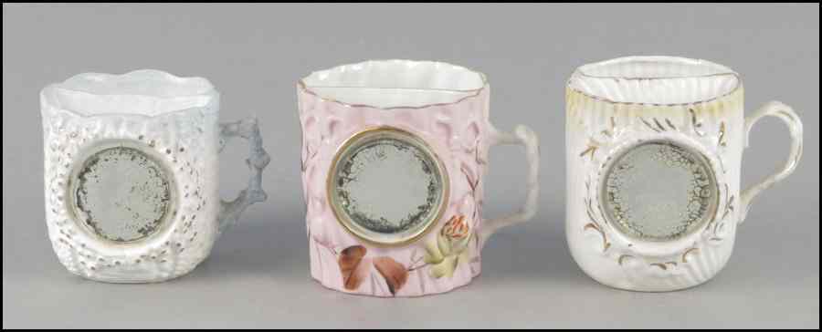 Appraisal: GROUP OF THREE PORCELAIN SHAVING MUGS All having adhered beveled