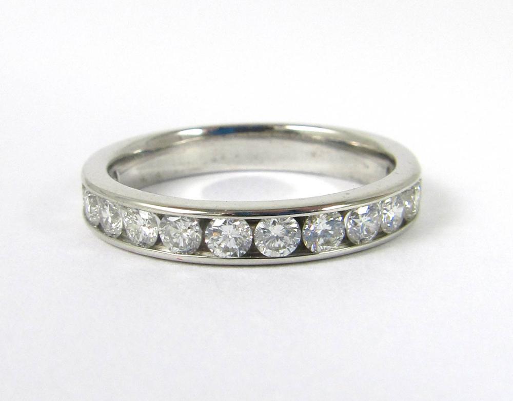 Appraisal: DIAMOND AND FOURTEEN KARAT WHITE GOLD RING channel set with