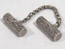 Appraisal: Royal Memorabilia A silver cape chain toggles the two shaped