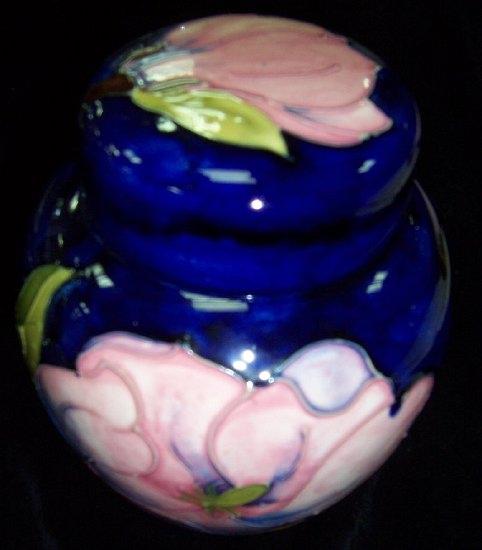 Appraisal: A Moorcroft ginger jar and cover decorated magnolias cm high