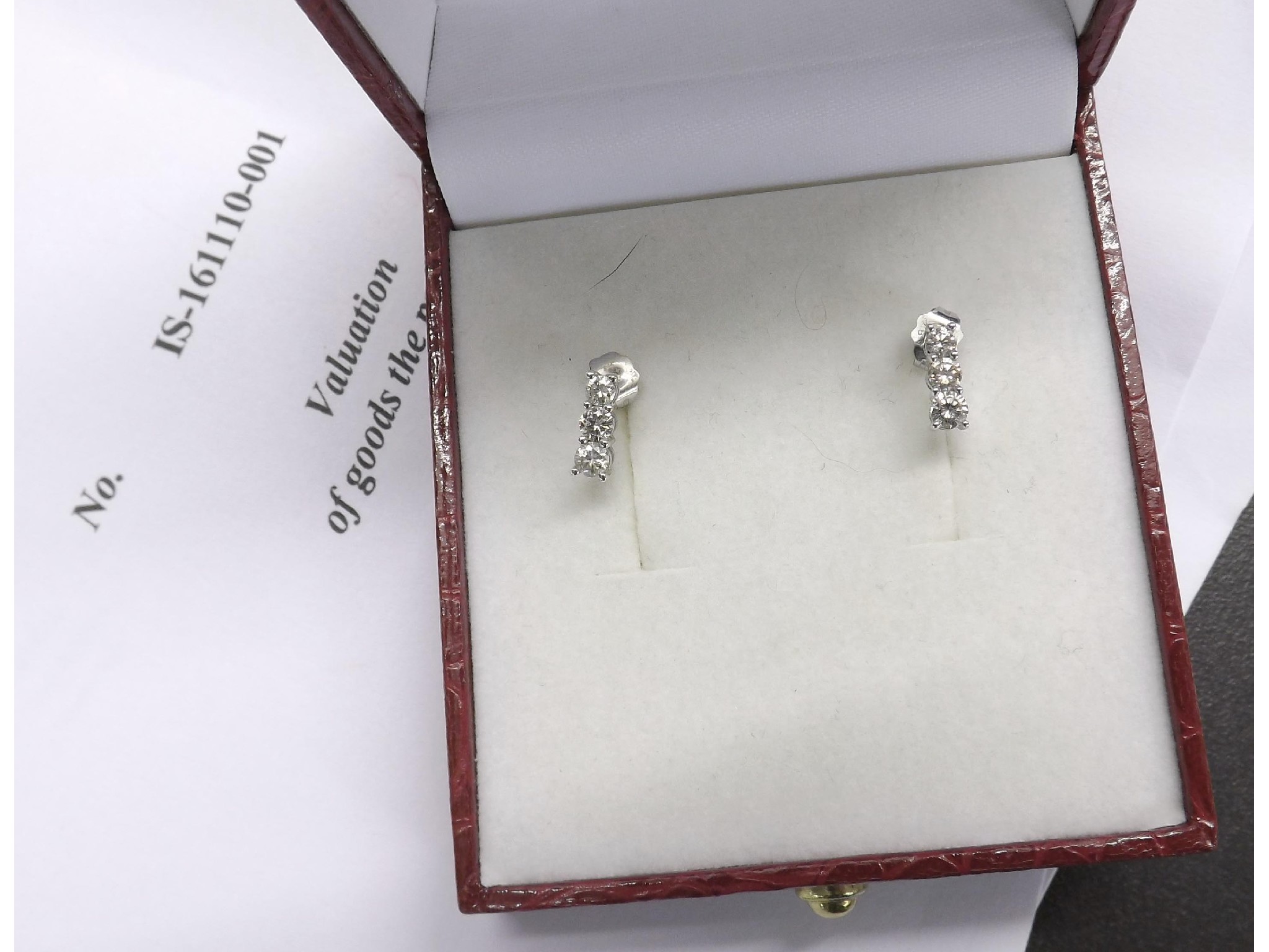 Appraisal: Pair of ct white gold graduated three stone diamond earrings