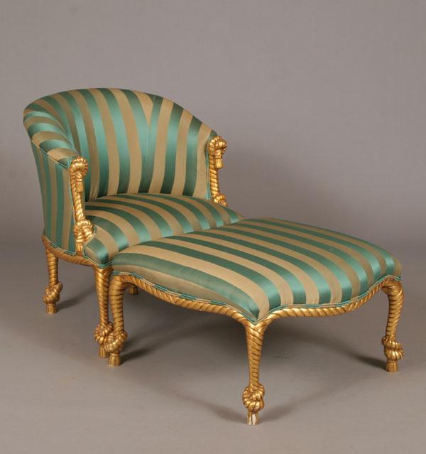 Appraisal: Art deco upholstered chair and ottoman continuos back gilt rope