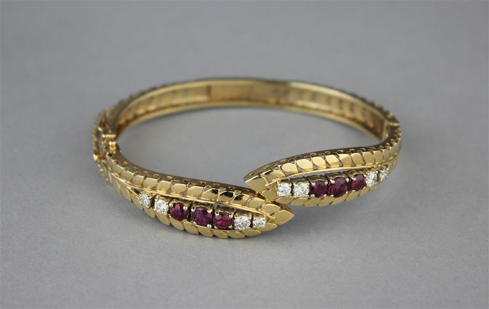 Appraisal: K GOLD HINGED BANGLE BRACELET SET WITH RUBIES AND DIAMONDS