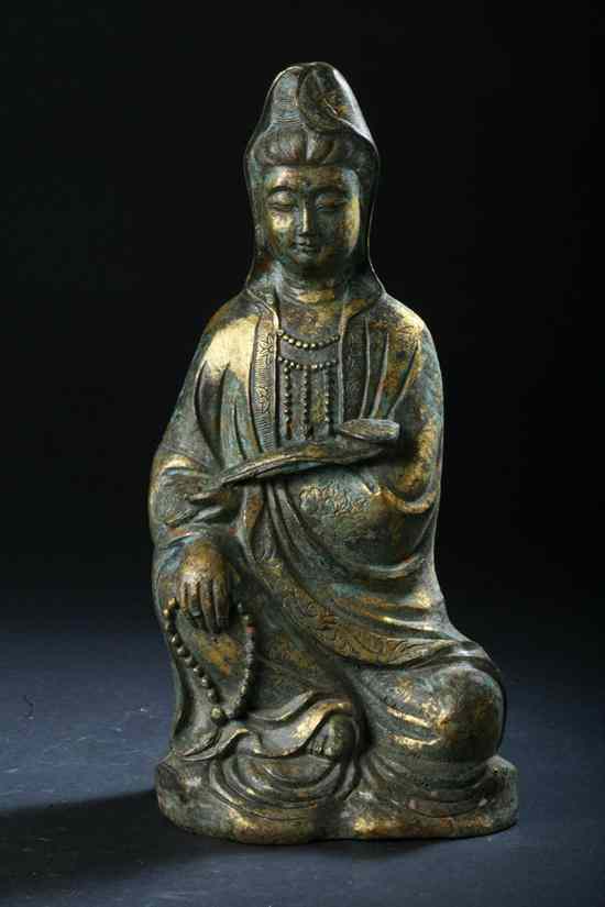 Appraisal: CHINESE GILT BRONZE FIGURE OF GUANYIN Seated at ease wearing