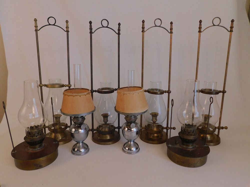 Appraisal: NAUTICAL LAMPS Lot nautical lighting items brass candleholders with glass