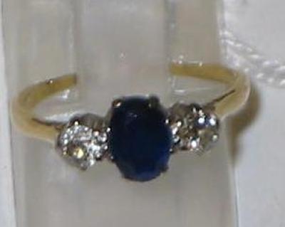 Appraisal: A SAPPHIRE AND DIAMOND THREE STONE RING the oval cut