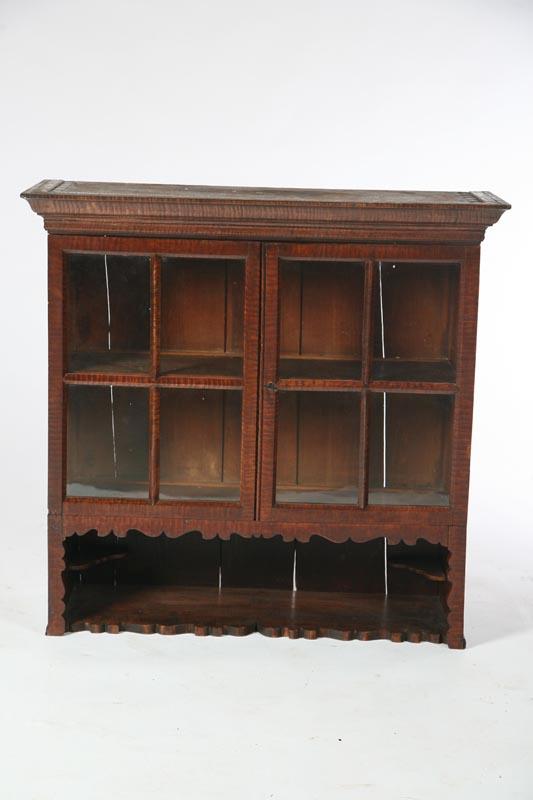 Appraisal: HANGING CUPBOARD American mid th century curly maple with pine