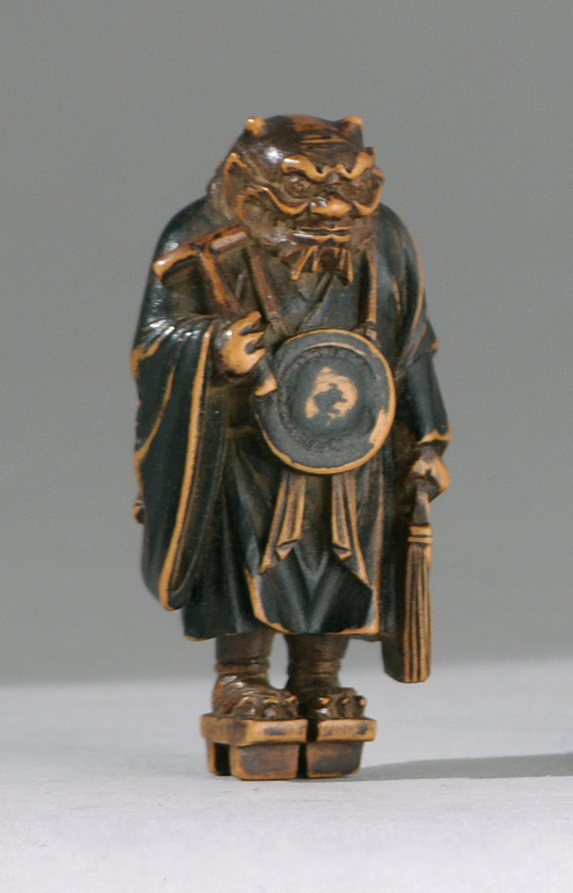 Appraisal: WOOD NETSUKE th CenturyIn the form of the oni Nembutsu