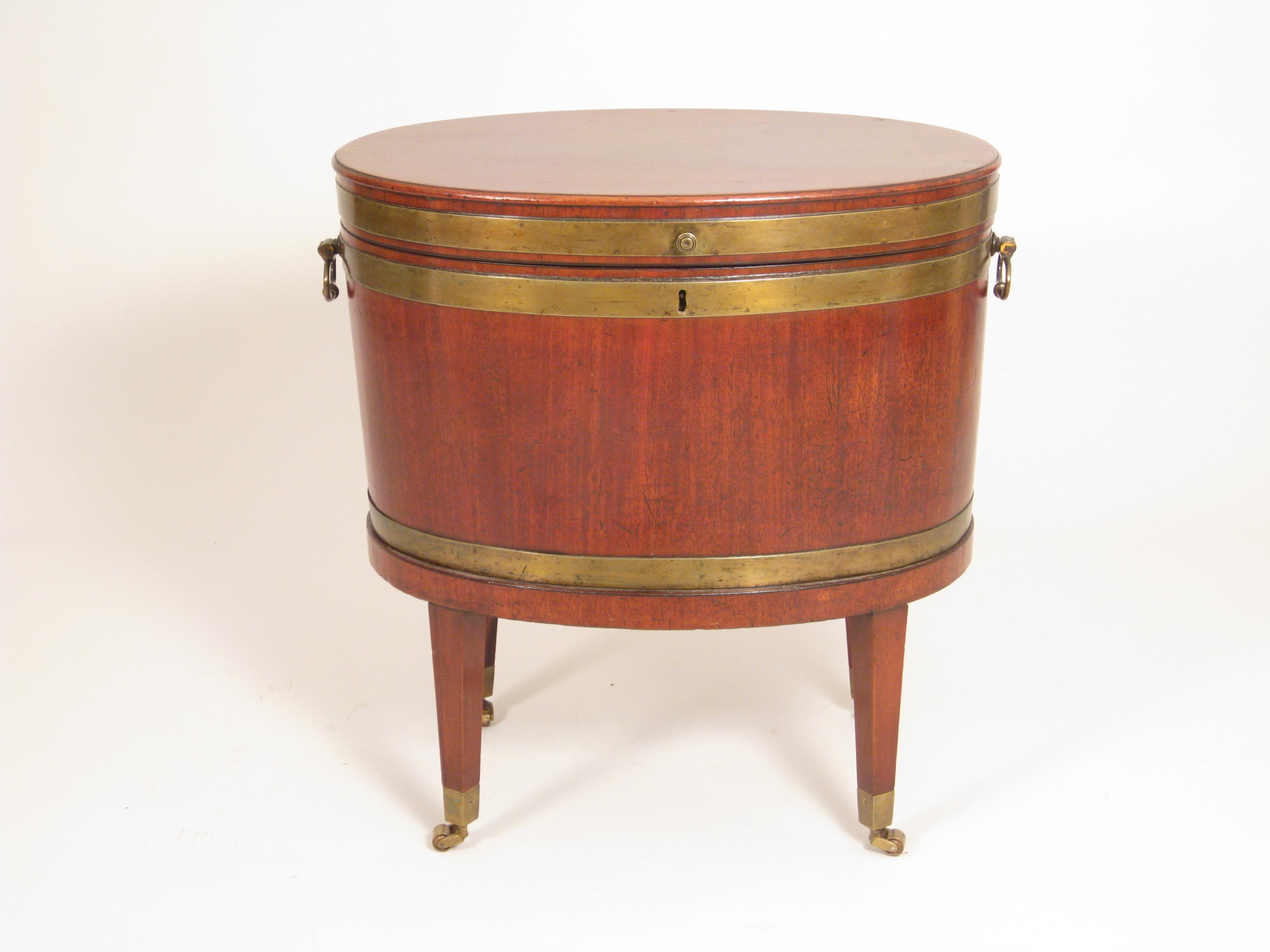 Appraisal: A George III brass bound mahogany oval Wine Cooler with