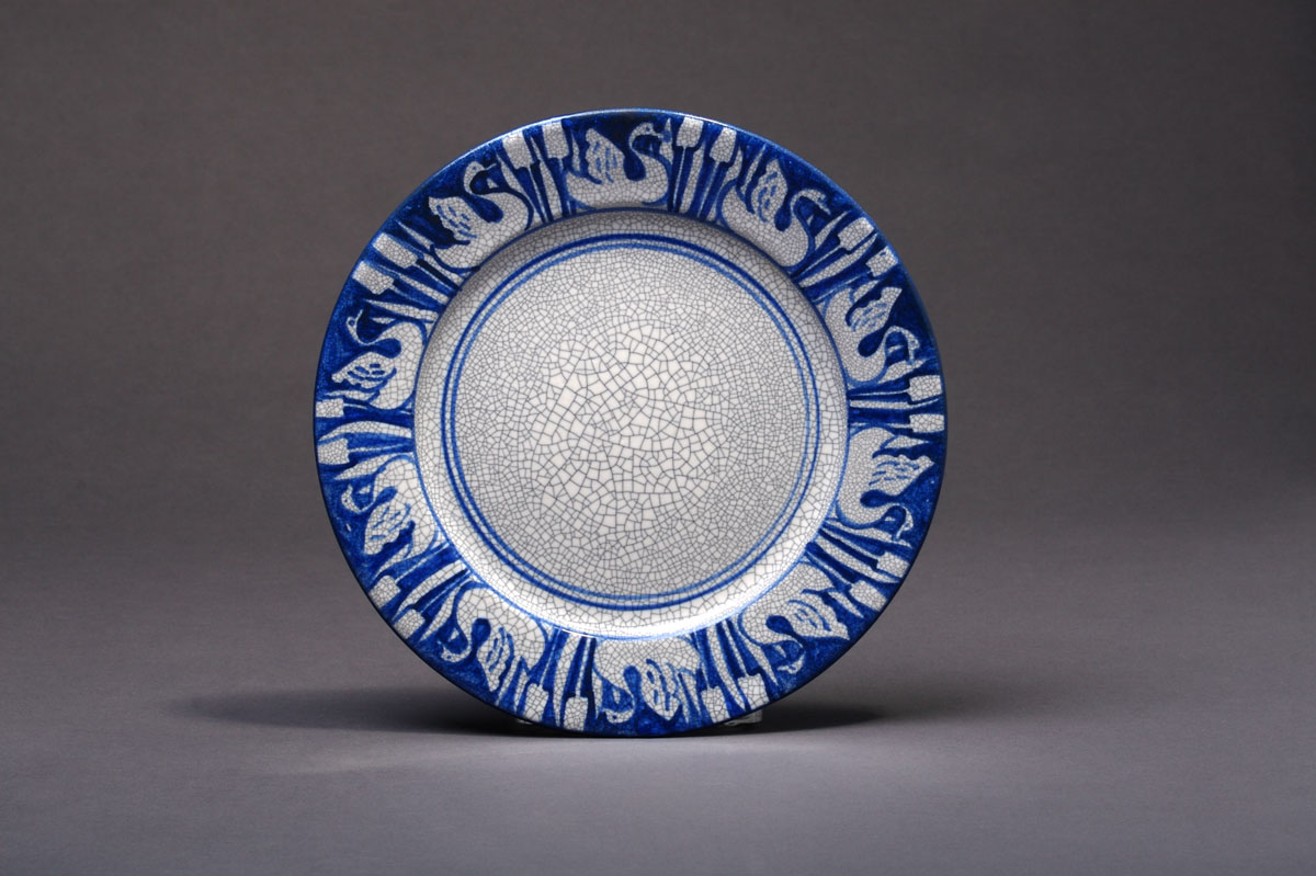 Appraisal: DEDHAM POTTERY 'SWAN' PATTERN PLATE Painted in medium blue with