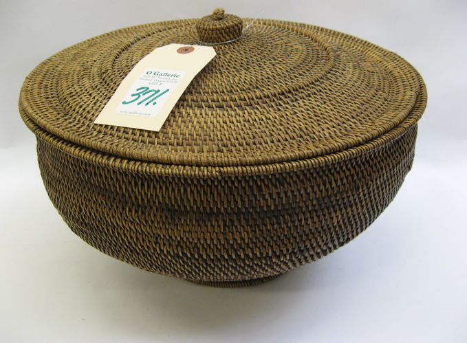 Appraisal: AN INDONESIAN COVERED AND FOOTED STORAGE BASKET hand woven with